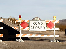 Road closed sign blocks the road