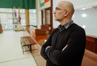 Instructor looks out into empty classroom