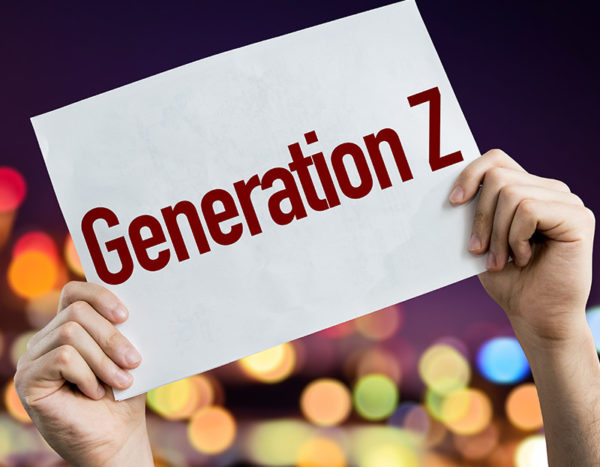 Hands hold up sign for educating generation Z students