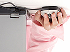 Person's hand is on computer mouse but flipped upside down