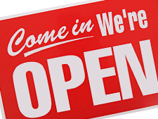 Sign displays, "Come in, We're Open."