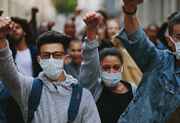 Students come together in protest and masks during times of crisis