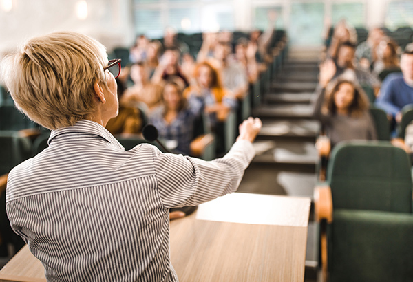 Instructor demonstrates effective teaching in front of group of students