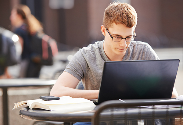 students taking notes on computer