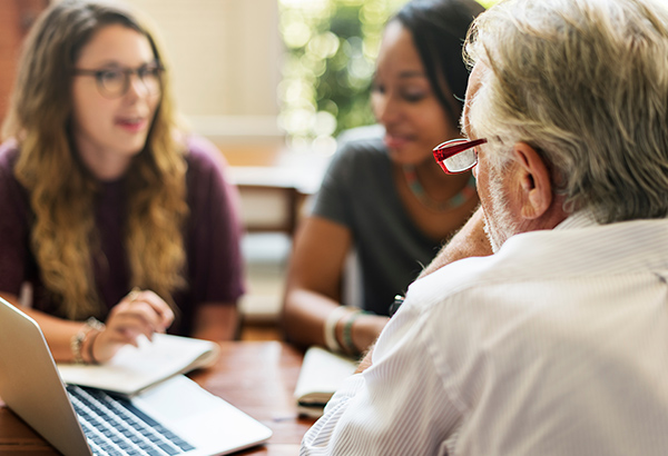 professionals-talking-to-each-other-during-meeting