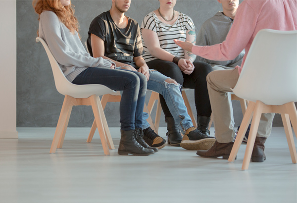 students-sitting-in-chairs-discussing