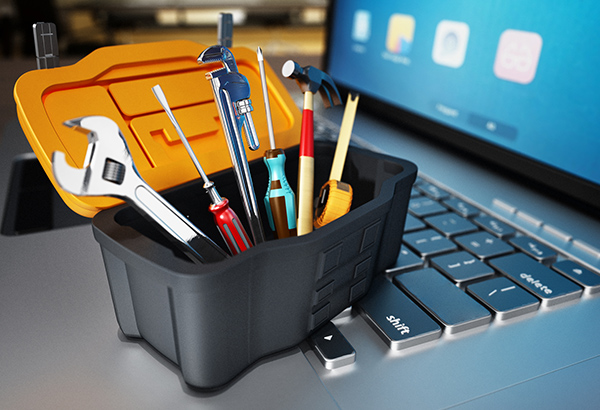 toolbox-sitting-on-top-of-laptop-computer