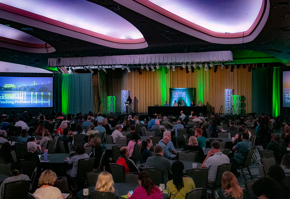 a panel discussion being held in a ballroom at the teaching professor conference