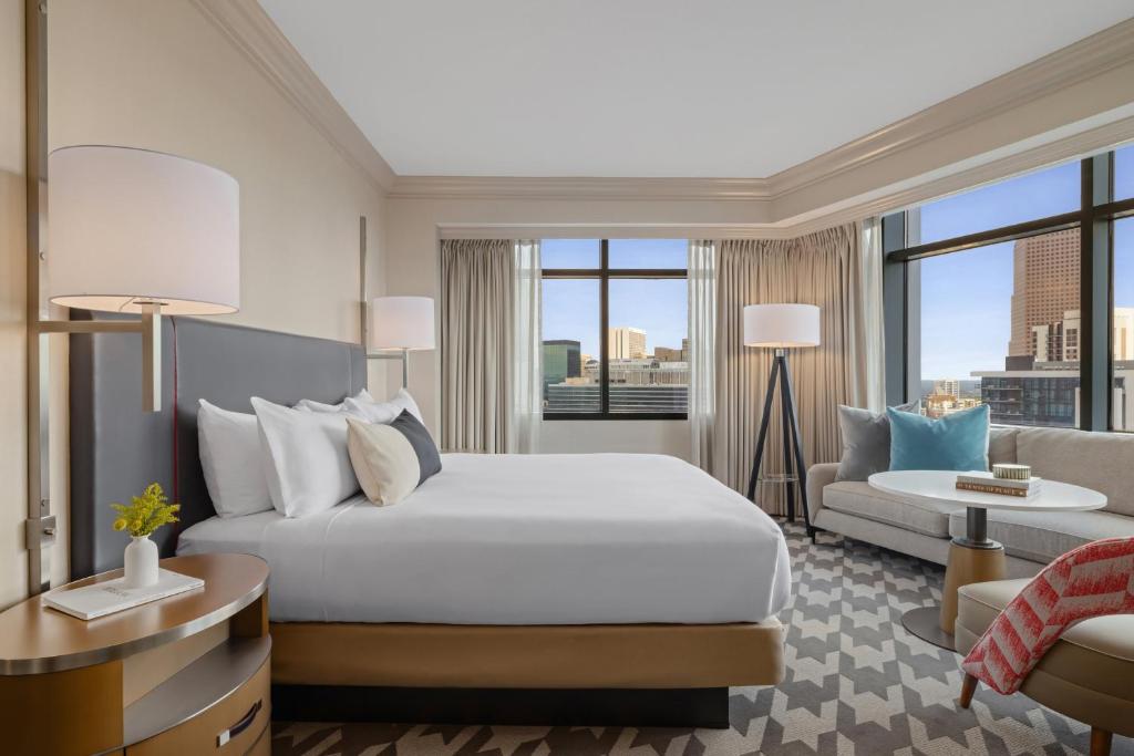 guest room with a king sized bed at the Omni Atlanta Hotel